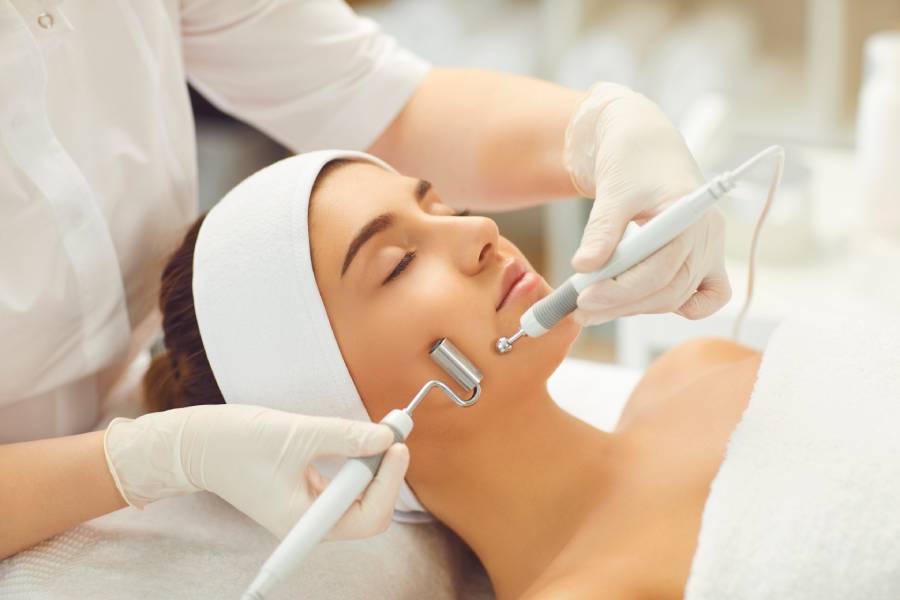 Woman receiving facial treatment