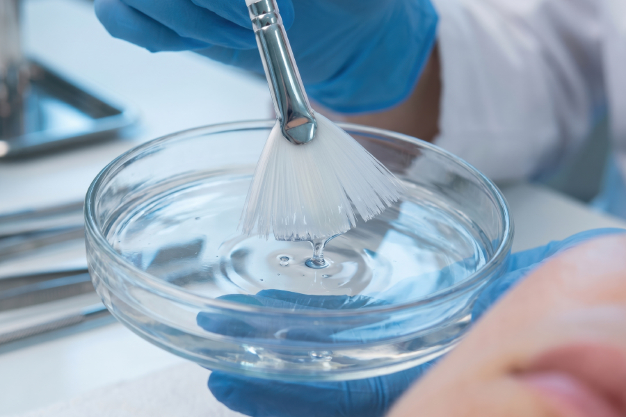 Professional skincare treatment with chemical peel and brush at Sculpt Medispa