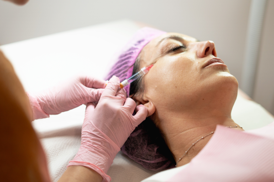 Patient receiving a collagen-stimulating Sculptra treatment at a medical aesthetics clinic in Richmond Hill.